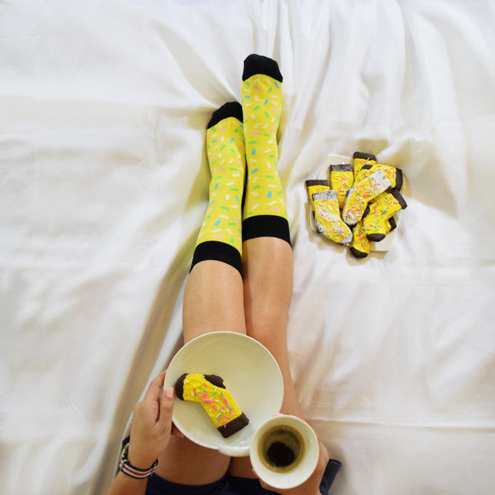 Socks - Sprinkle Summer. Women socks top view with coffee .